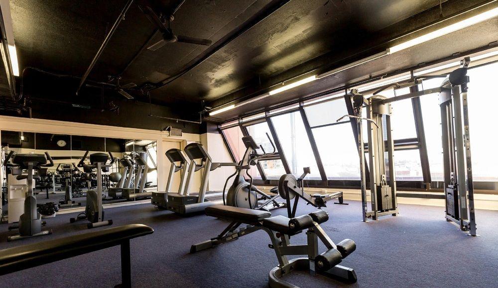 מלון גלנלג Stamford Grand Adelaide מראה חיצוני תמונה The photo shows a modern gym interior with large windows that provide natural light. The space features various exercise equipment, including treadmills, a weight machine, and a multi-purpose bench. The flooring is carpeted, and the overall decor is 