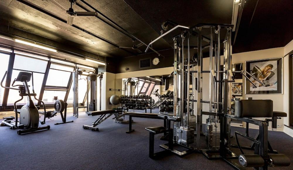 מלון גלנלג Stamford Grand Adelaide מראה חיצוני תמונה The photo shows the interior of a gym or fitness room. It includes various exercise equipment, such as a multi-station weight machine and rowing machine. The space is well-lit with large windows allowing natural light in, and the walls are decorated 